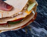 A picture of step 7 of Tortilla Wrap with egg and veggies.