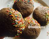 A picture of step 3 of Chocolate cookies partly covered in Sprinkles.