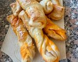 A picture of step 9 of Puff Pastry Twists with 'Nduja Spread, Speck, and Ragusano Cheese.