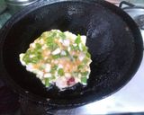 A picture of step 2 of Onion omelette with bread slice.