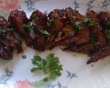 A picture of step 9 of Sticky orange wings.