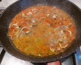 A picture of step 1 of Spaghetti with Squid Ink, Clams, and Pistachios.