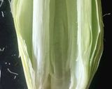 A picture of step 1 of CHEESY BUTTERI CORN on COB.