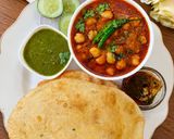 A picture of step 10 of Shahi Chhole Bhature prepared with garam masala.