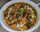 A picture of step 10 of Mushroom Baby Corn Curry.