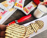 A picture of step 8 of Instant Marie biscuit Cake.