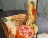 A picture of step 3 of 3 layered cheese sandwich.
