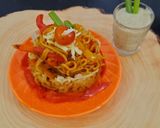 A picture of step 6 of Schezwan noodles in noodles basket with kiwi banana smoothie.