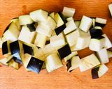 A picture of step 1 of Warm aubergine salad with giantwholewheat couscous and smoked cheese.