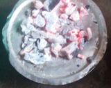 A picture of step 6 of Mbuzi pilau using a jiko.