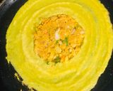 A picture of step 3 of Moong dal chilla stuffed.