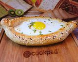 A picture of step 6 of Khachapuri with four cheese.