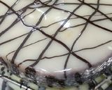 A picture of step 8 of Eggless Whole wheat Vanilla cake with white chocolate ganache.