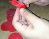 A picture of step 8 of Valentines day special fondant red rose cake topper.