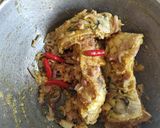 A picture of step 2 of Katla fish in gourd leaves.