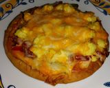 A picture of step 6 of Pita Breakfast Pizza.