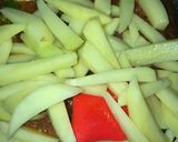 A picture of step 3 of Tawa masala fries.