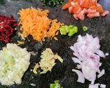 A picture of step 1 of Oats, Veggies Chilla.