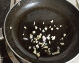A picture of step 4 of Spinach Corn Ravioli in white sauce.