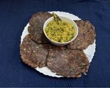A picture of step 6 of Ragi rotti with drumstick leaves.