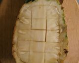A picture of step 3 of Fruit salad in a pineapple boat.