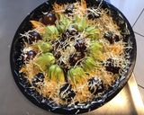 Une image de l'étape 9 de Fleurs de courgettes farcies aux crevettes tomates cerises noires et deux fromages.