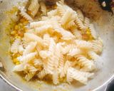 A picture of step 5 of CREAMY PESTO PASTA 😋 With BASIL Leaves.