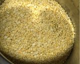 A picture of step 1 of Narkel diye Bhaja Muger Dal: Bengali Style- Yellow Moong Dal with Coconut (Without Onion-Garlic).