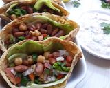 A picture of step 19 of Pita Bread Chick Pea Kidney bean filling with Tzatziki sauce.