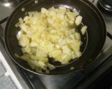 Foto del paso 5 de la receta Horneado de jamoncitos de pollo con patatas a la naranja