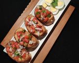 A picture of step 6 of FRENCH GARLIC TOAST with TOMATO SALAD paired with BOILED EGGS..