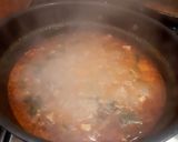 A picture of step 4 of Thai Chicken Tom yum soup.