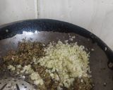 A picture of step 8 of Bharva karele.