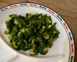 A picture of step 1 of Capsicum with gram flour 🫑🫑🧅🧅.