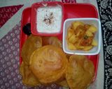 A picture of step 34 of Gujrati masala puri with aloo sabji.