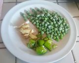A picture of step 1 of Stir fried Cabbage, green peas, bok choy stuffed Pita bread.