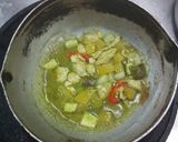 A picture of step 4 of Green Curry Chicken in Young Coconut.