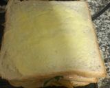 A picture of step 8 of Scrambled eggs and masala fries sandwich.