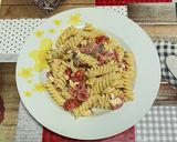 A picture of step 4 of Cold Pasta with Stracciatella, Cherry Tomatoes, and Guanciale 🤩.