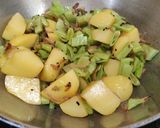 A picture of step 4 of Sem Aloo with Kalonji Seeds.