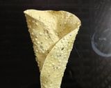 A picture of step 4 of Papad Cone Bhel puri.