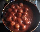 A picture of step 10 of Grandma's Meatballs - with Tomato Oregano Sauce.