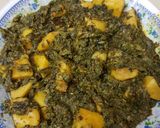 A picture of step 12 of Aalu palak.