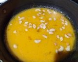 A picture of step 3 of Custard powder halwa with roasted sesame seeds.