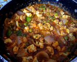 A picture of step 10 of Veg kolapuri.