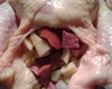 A picture of step 6 of Whole Roasted Chicken, stuffed with apples and sausage.