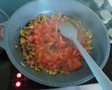 A picture of step 2 of Madurai egg kari dosa.