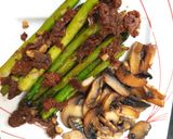 A picture of step 6 of My Roasted Garlic Asparagus with sundried Tomato & Mushrooms. 😁.