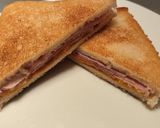 A picture of step 3 of Ham, cheddar and HP brown sauce fried toastie.
