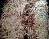 A picture of step 4 of Stuffed Zucchini Gratin in a Dutch Oven.